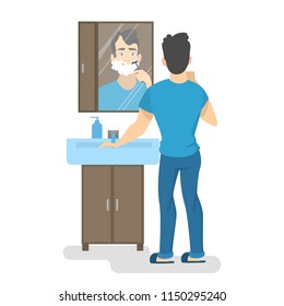 Man shaving his beard with razor in bathroom in front of the mirror. Morning routine and skin care. Isolated vector illustration in cartoon style