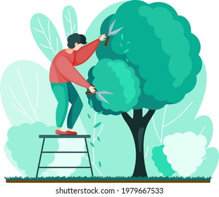 Man shears plants with scissors stands on stairs. Professional garden worker working with tree in backyard. Gardening, planting topiary plants and hedges design. Agriculture, gardening and farming