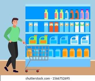 Man with shopping cart choosing dairy products. Male character looking at bottles with milk and yogurt standing in refrigerator of supermarket. Personage with trolley at groceries department