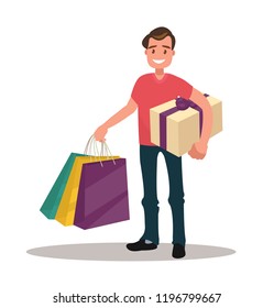 Man is shopping. Man holding bags and gift box.