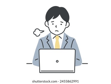 Man sighing while working at his desk.