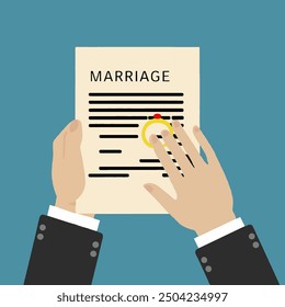 man signing marriage contract papers with ring on the table. marriage concept