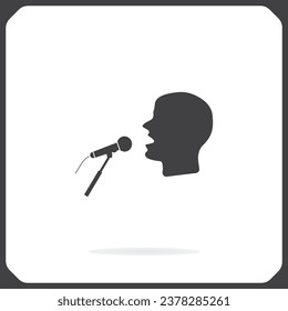 Man singing into microphone, vector icon. The head of a man singing into a microphone. A flat illustration of a man with a microphone.