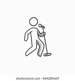 Man singing with microphone vector sketch icon isolated on background. Hand drawn Man singing with microphone icon. Man singing with microphone sketch icon for infographic, website or app.