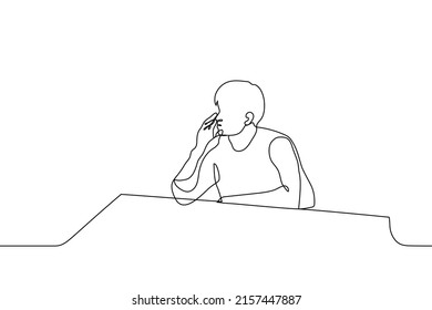 man sits alone at the bar and props his head up with his hand - one line drawing vector. concept a loner sits waiting for someone or is bored
