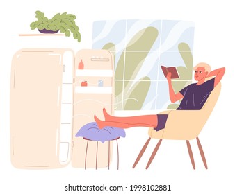 Man sits by an open refrigerator and chills out in the heat