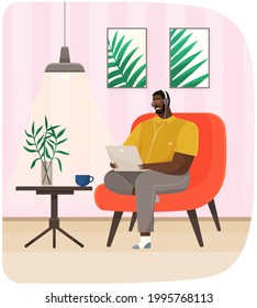Man sits in chair with laptop and headphones. Remote work, freelance, online training concept. Checking email, watching video, searching for information on Internet. Male character sits with computer