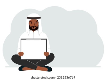 A man sits crossing his legs and holds a clipboard with a white read sheet for the text in his hands.