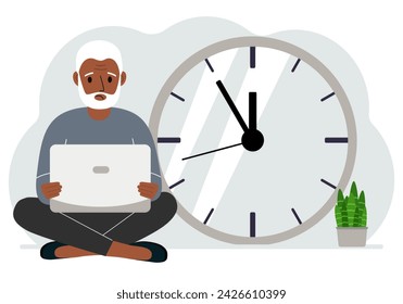 A man sits cross-legged and holds a laptop. Next to the big clock. Time management concept, little time, much time, deadline.