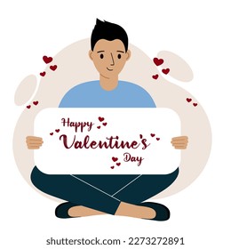 A man sits cross-legged and holds a large card with a congratulation for saint valentine. Vector flat illustration