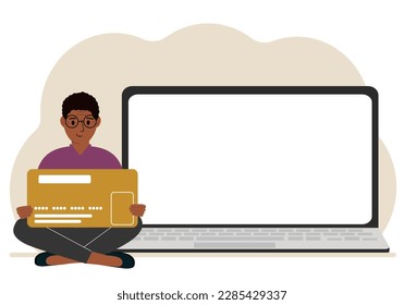 A man sits cross-legged and holds a large plastic card. Next to the man is a large laptop with space for text. Vector flat illustration