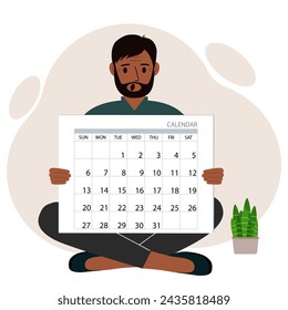 A man sits cross-legged and holds a large calendar glider in his hands. Concept of planning, make plans, schedule, event.