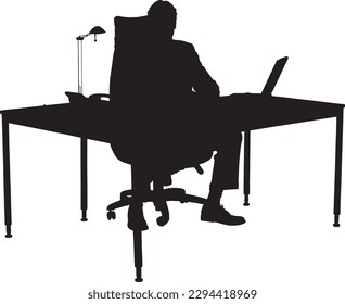 A man sits at a desk in front of a laptop.