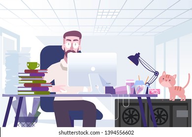 Man sits in an office at a computer desktop, loaded with work and around a mess