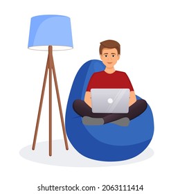Man sits on a bean bag chair and works at a computer. Remote work, office at home, programming, freelance. Study at home in quarantine. Vector illustration.