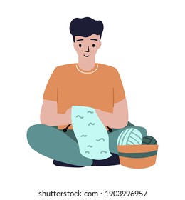 A man sits on the floor and knits from woolen yarn. Vector illustration