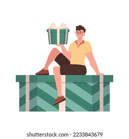 A man sits on a gift box. Modern flat vector illustration.