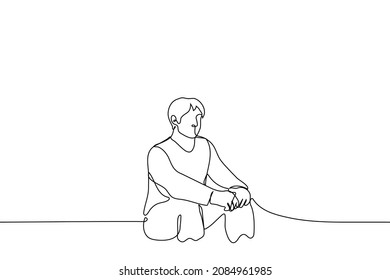 Man Sits On Low Seat With His Legs Wide Apart, Palms Folded Together - One Line Drawing Vector. Relaxation Concept, Procrastination, Laziness, Anticipation 