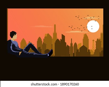 A man sits on a window sill on a tall building looking at the view of the city at sunset with an orange sky background.