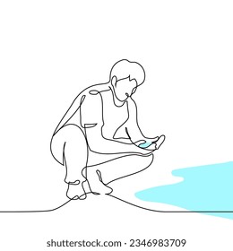 man sits squatting scooping up water from a puddle or river in his palm - one line art vector. concept water pollution, water sample