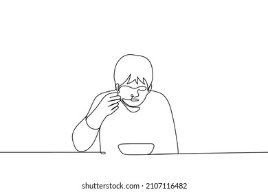 Man Sits At Table And Eats Soup From Deep Bowl Bringing Spoon To His Mouth - One Line Drawing Vector. Concept Of Eating Hot Broth, Soup; Sick Person Eats Broth 