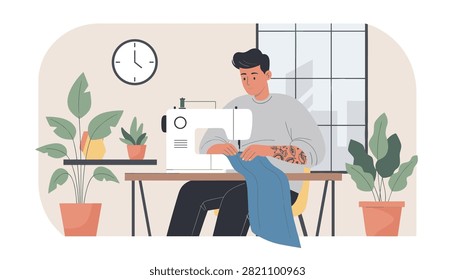 Man sits at a wooden table operating a sewing machine in a bright studio with indoor plants and a wall clock.