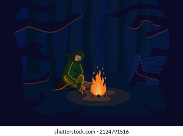 Man sits in the woods by the campfire. A hunter in the forest at night. Camping