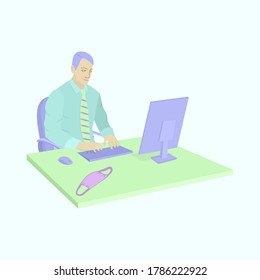 A man sits and works at an office table on a computer