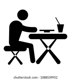 
A man sitting alone on a table having food and drinks, lonely party 
