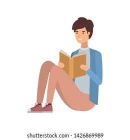 man sitting with book in hands