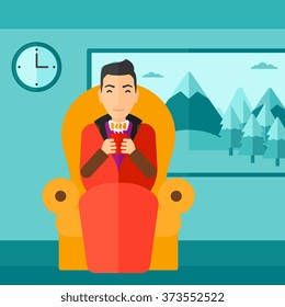 Hombre sentado en una silla con una taza de té.