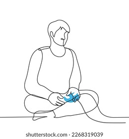 man sitting cross-legged and holding a joystick on a wire - one line drawing vector. concept play video games