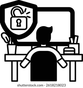 A man is sitting at a desk with a computer monitor and a keyboard