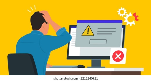 Man sitting at desk and using a computer, he receives an error message notification on a dialog box window