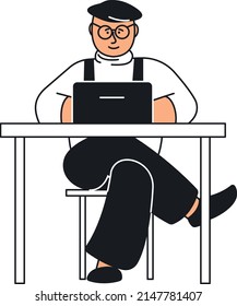 Mann sitzt am Schreibtisch und arbeitet am Laptop. Freiberufler