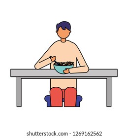 man sitting eating fruits in plate