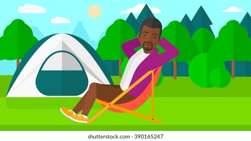 Man sitting in folding chair.