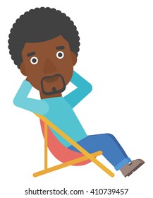 Man sitting in a folding chair.