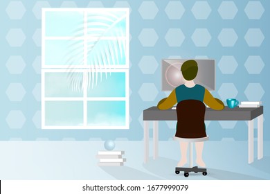 a man sitting in front of the computer working at home. 