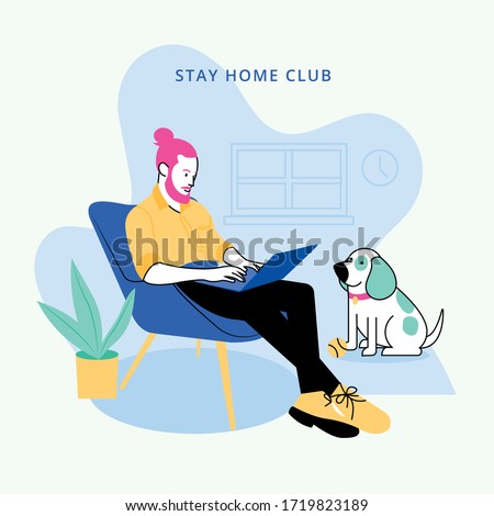 Man sitting with his laptop working at home with his dog
