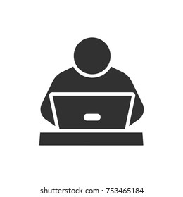 A man sitting at a laptop