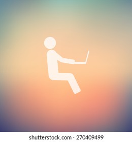 Man sitting with laptop icon in flat style for web and mobile, modern minimalistic flat design. Vector white icon on gradient mesh background