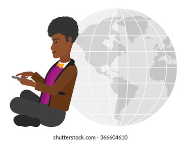 Man sitting near globe.