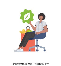 A man is sitting next to a bag of healthy food and is holding an EKO icon. Isolated on white background. Flat trendy style. Vector.