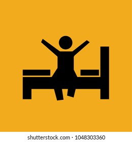 Man Sitting on Bed Who Just Woke Up Yawning