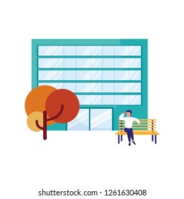 man sitting on bench building tree