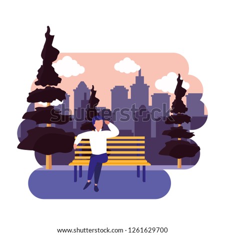 man sitting on bench park city outdoor