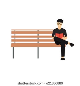 man sitting on bench reading book
