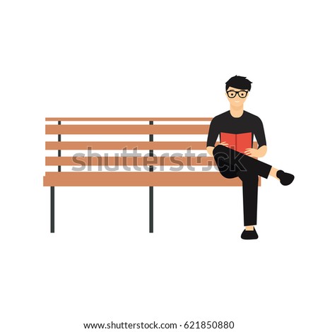 man sitting on bench reading book