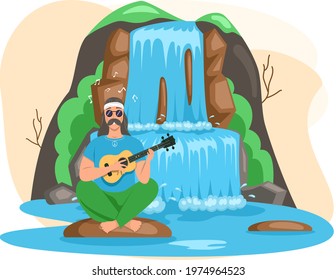 Man sitting on big stone playing guitar next to rock and waterfall, singing songs resting on nature landscape. Tropical river and beautiful waterfall in mountains with plants, lake and bush foliage